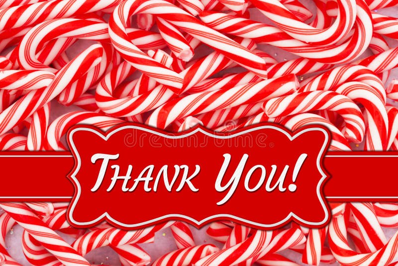 Christmas Thank You message on a banner on a pile of red and white candy canes. Christmas Thank You message on a banner on a pile of red and white candy canes