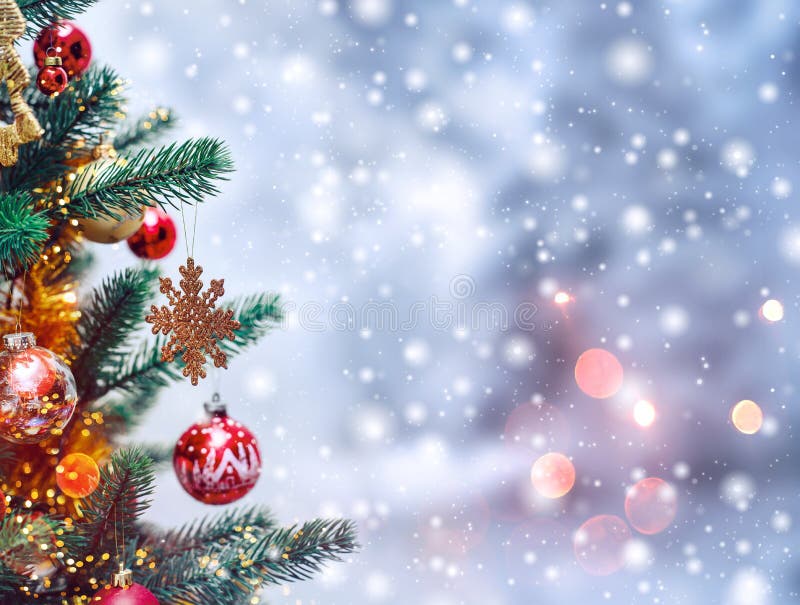 Christmas tree background and Christmas decorations with snow, blurred, sparking, glowing.