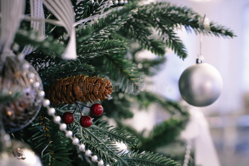 Christmas Tree Branch Decorated with Silver Balls and White Decor Stock