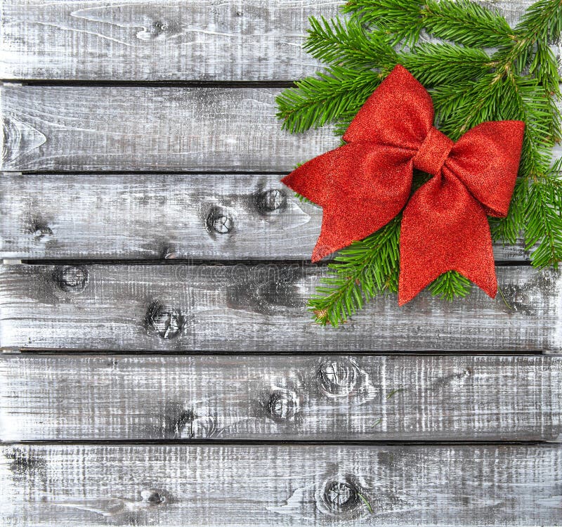 Christmas Tree Branches Red Ribbon Bow Rustic Wooden Background