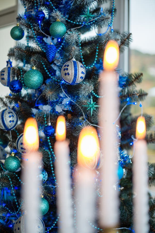 Christmas Tree after the Candlestick with Lighted Candles Stock Photo