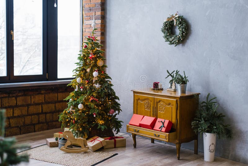 Christmas Tree, Chest of Drawers with Gifts in the Living Room Loft ...