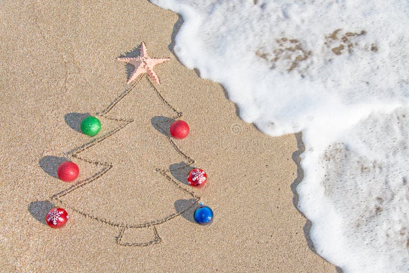 Christmas tree contour with decorations, star and wave on the beach