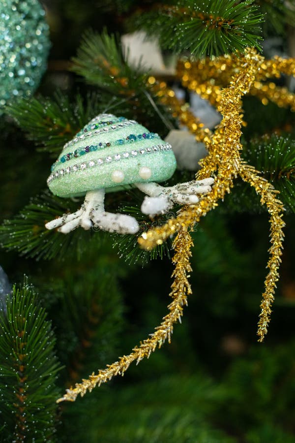 Christmas tree decorated in a marine style. Emerald crab with a golden coral branch, decorated with pearls, postcard stock images Christmas tree decorated in a marine style. Emerald crab with a golden coral branch, decorated with pearls, postcard stock images