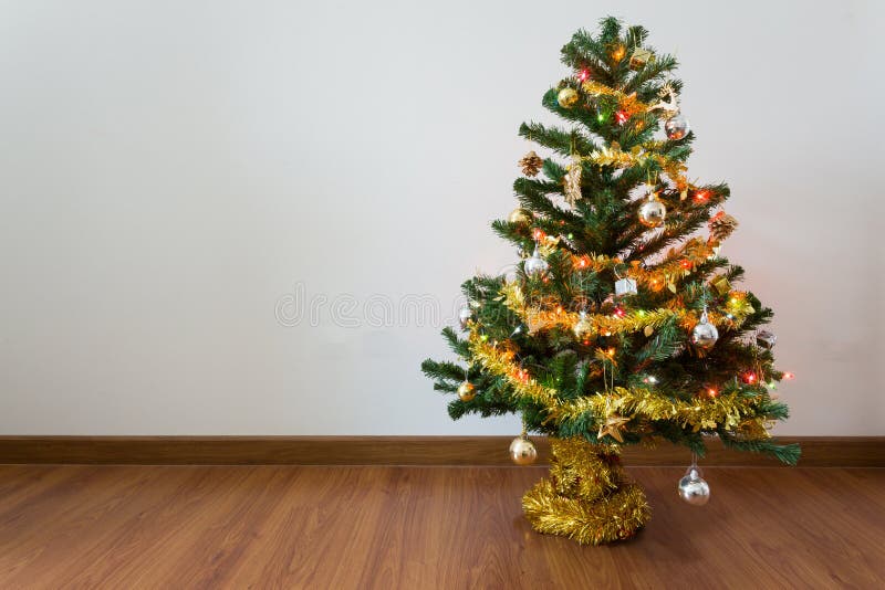 Christmas tree decoration in empty room with white wall