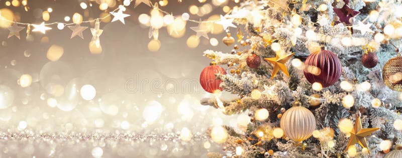 Christmas Tree with Decorations and Glitter. Gold Background