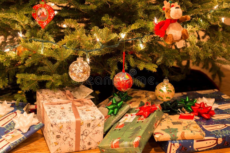 Christmas Tree with Decorations and Present Under Christmas Tree Stock