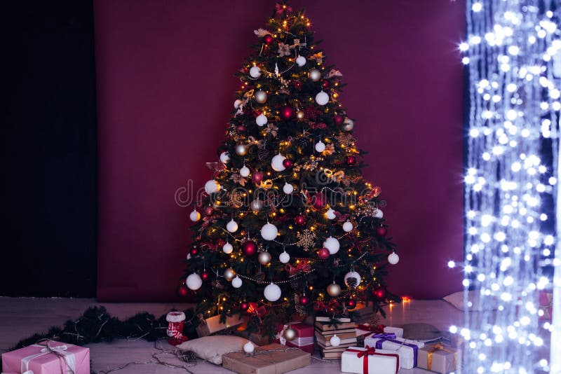 Christmas Tree with Gift Lights Garland Decor New Year Stock Image