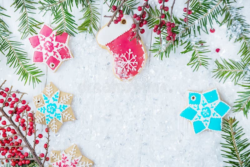 Christmas tree and gingerbread on a light background. New year celebration and christmas concept stock image Christmas tree and gingerbread on a light background. New year celebration and christmas concept stock image