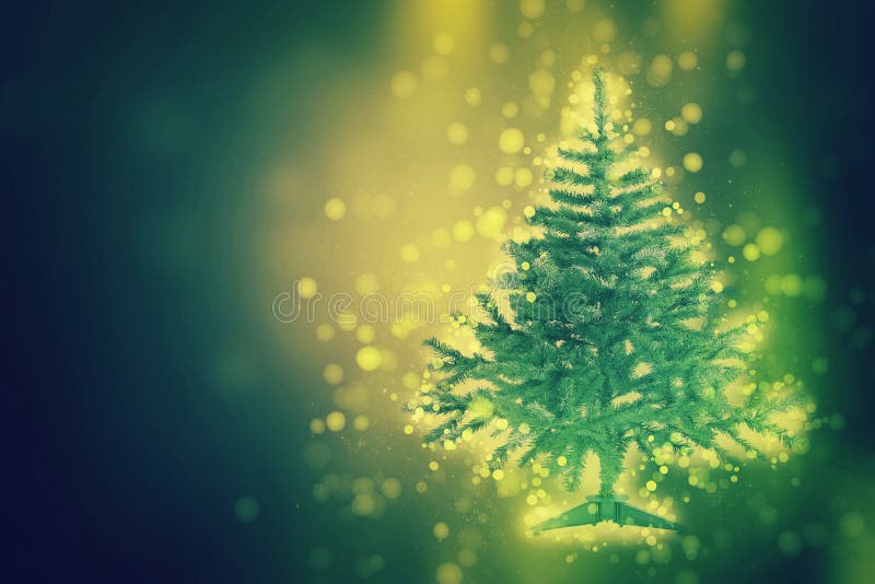Christmas tree on the glow glitter background. Elegant abstract background with bokeh royalty free stock photos