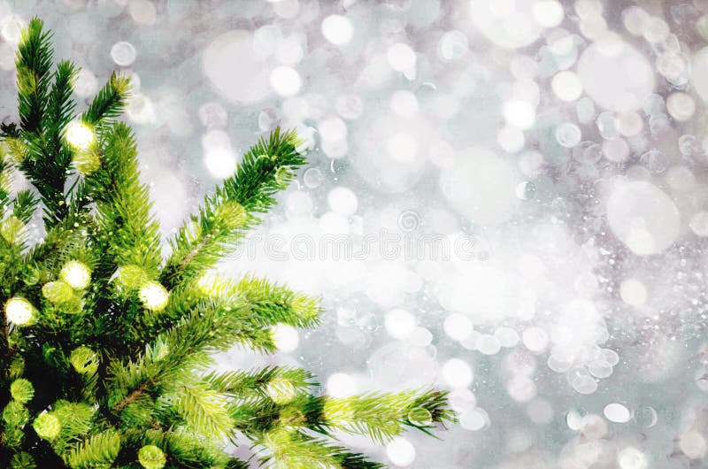 Christmas tree on the glow glitter background. Elegant abstract background with bokeh stock images