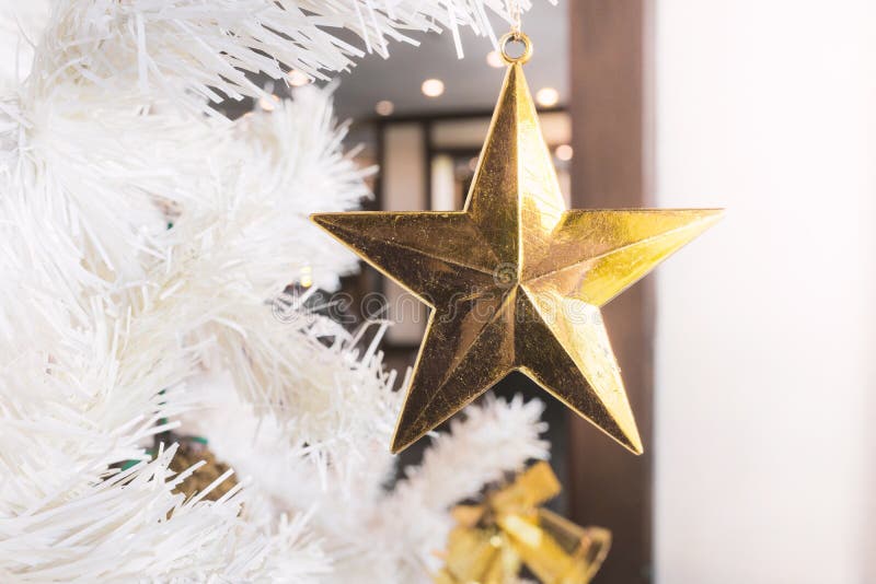 Golden Star with Red Green Ball and White Christmas Tree Background