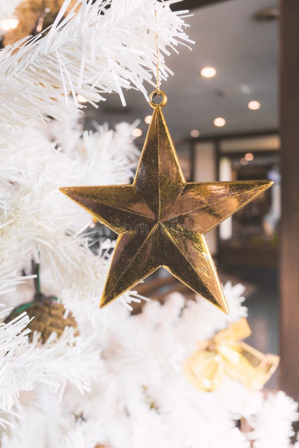 Golden Star with Red Green Ball and White Christmas Tree Background