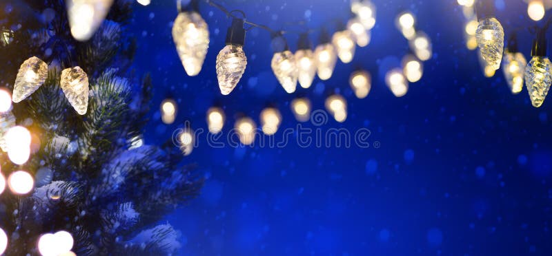 Christmas Tree Light Over Snowy Dark Blue Sky Background Stock Image