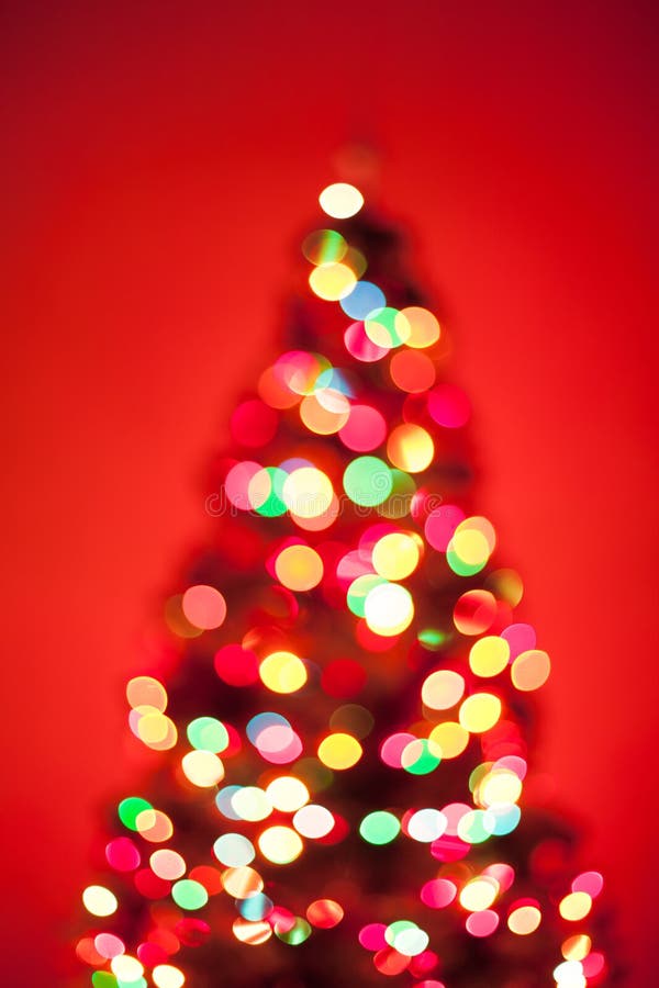 Christmas tree lights on red background