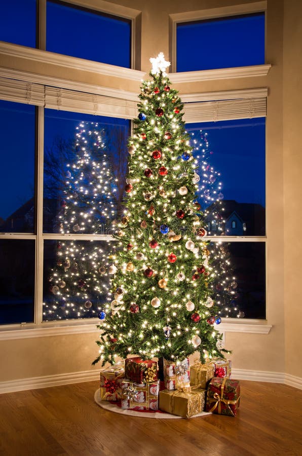 Brightly Lit Christmas Tree with Gifts Stock Image - Image of holiday ...