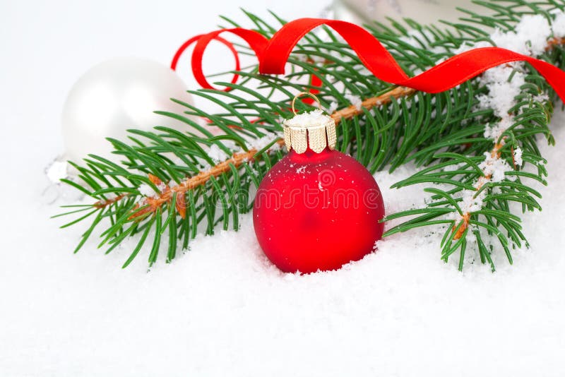 Christmas tree and red ball on snow