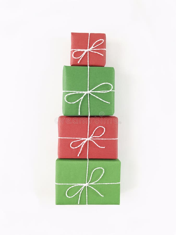 Christmas tree shape from red and green gift boxes on a white background. Holiday flat lay royalty free stock images