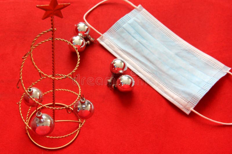Christmas Tree, Star and Spheres with Protection Mask on Red Background