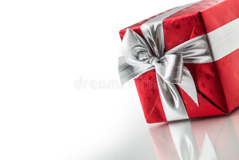 Christmas valentine or birthday red gift box with silver ribbon stock photos Christmas valentine or birthday red gift box with silver ribbon stock photos