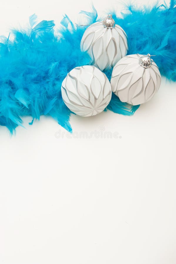 Christmas White Background with Blue Tinsel, Christmas Ball and Light Glare Stock Photo Image