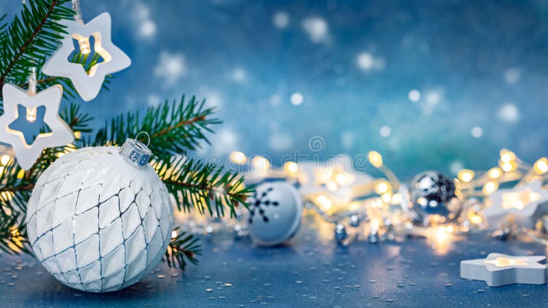 Christmas white glass ball against blue background with blurred glowing lights royalty free stock photos Christmas white glass ball against blue background with blurred glowing lights royalty free stock photos