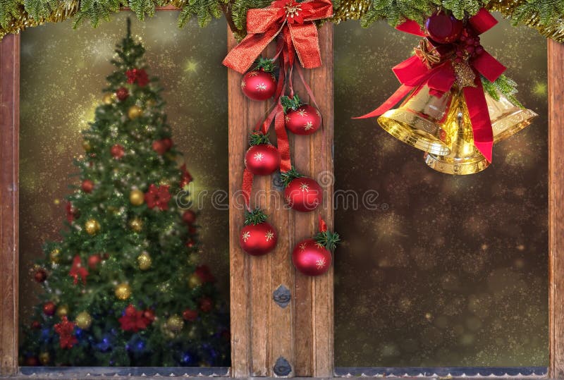 Christmas window,golden bells,decorations,snow,tree background for greeting card space for text