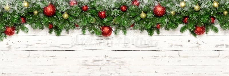 Christmas winter banner with snow and snowflake on white wooden background fir tree branches and new year toy ball or bauble. Xmas holiday decoration for promo stock images
