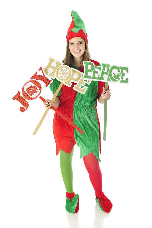 A pretty teen elf happily holding signs of Christmas wishes: Joy, Hope and Peace. On a white background. A pretty teen elf happily holding signs of Christmas wishes: Joy, Hope and Peace. On a white background.