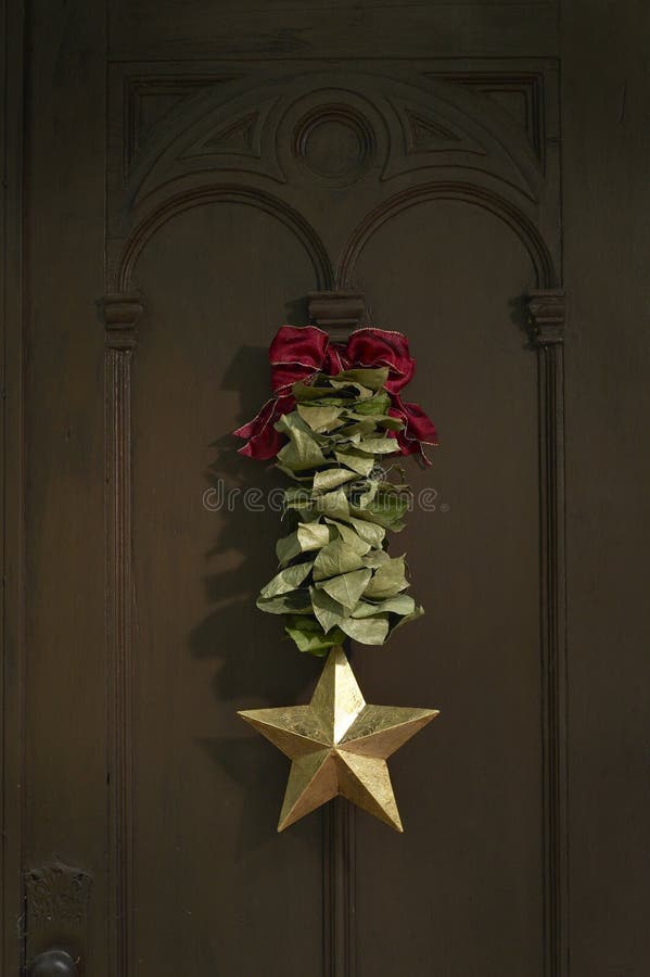 Green and White Feather Wreath on a Black Door Stock Image Image of