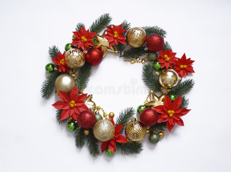 Christmas wreath on white background, banner with fir branches and balls. View from above. Colors are gold, red, green and white. stock images Christmas wreath on white background, banner with fir branches and balls. View from above. Colors are gold, red, green and white. stock images