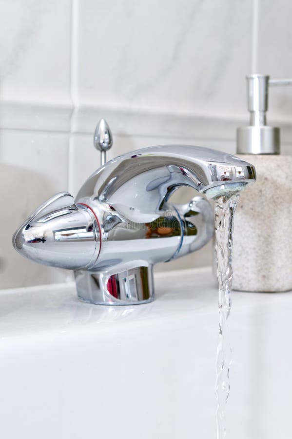 Running bathroom tap stock image. Image of sink, modern 10826759