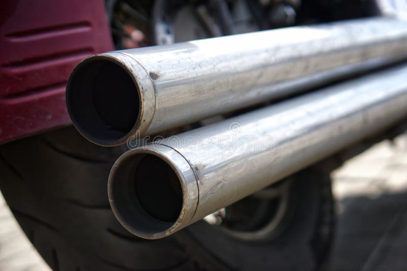 Chrome Double Motorcycle Exhaust Pipe. Problems of Ecology and Air