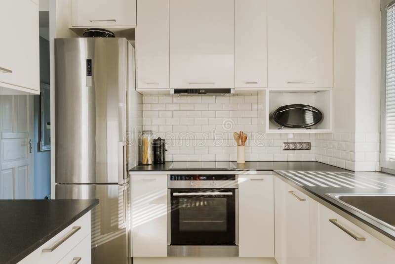 Chrome Fridge in White Kitchen Stock Photo - Image of design, cupboard