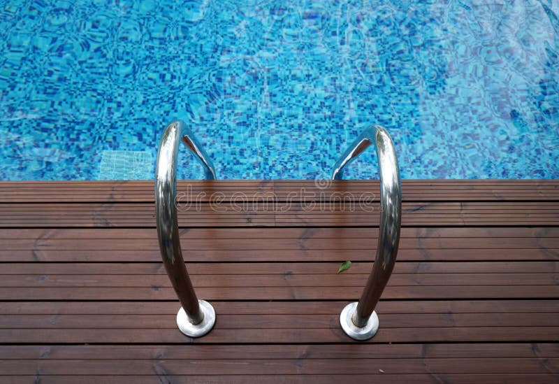 Chrome ladder into swimming pool