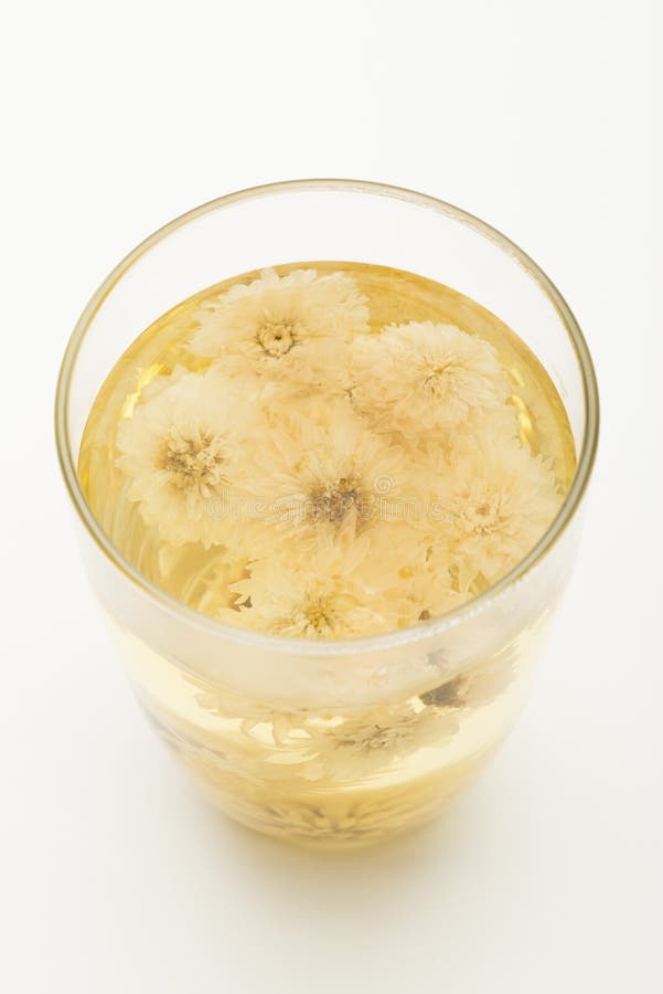 Glass of Chrysanthemum Flower Tea with Dry Chrysanthemum Flower Stock