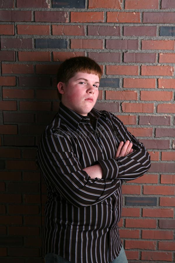 Chubby Teenage Boy With Arms Crossed Stock Photo - Image of white