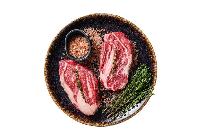 Chuck Eye Roll Beef Steaks, Raw Meat on a Plate with Thyme and Herbs