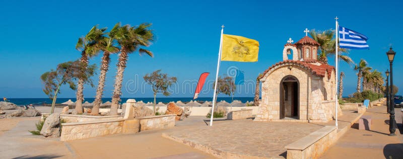 Church of Agios Dimitrios, Analipsi, Crete, Greece.  Analipsi beach with palms and Church