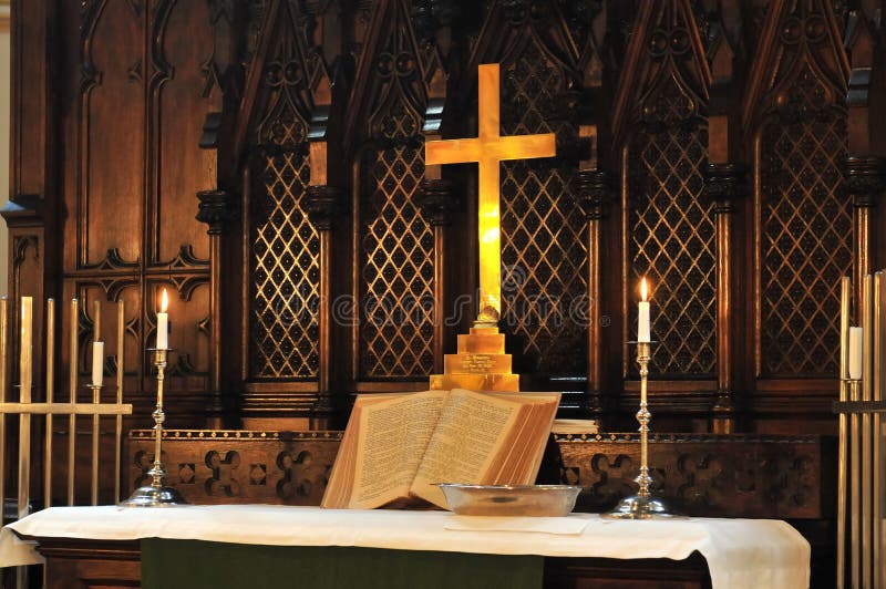 Church altar with Bible and candles