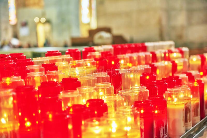 Church Burning Candles in Glass Candlesticks in the Cathedral. Stock