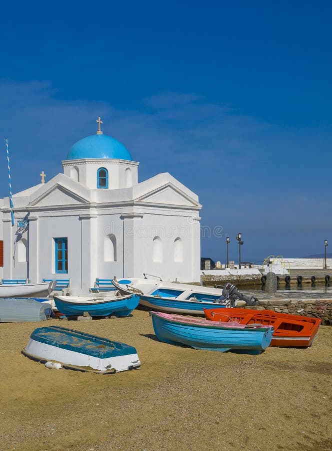 Church on Mykonos on the beach with boats