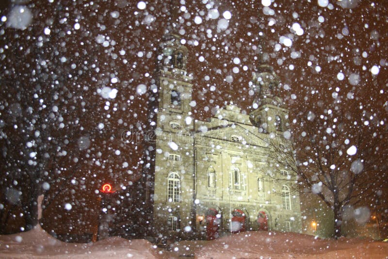 Church at night with falling snow