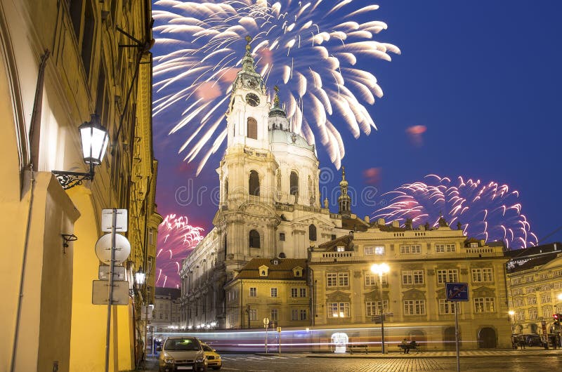 Church of St. Nicholas (Night view ) in the quarter of Mala Strana in Prague and holiday fireworks, Czech Republic.