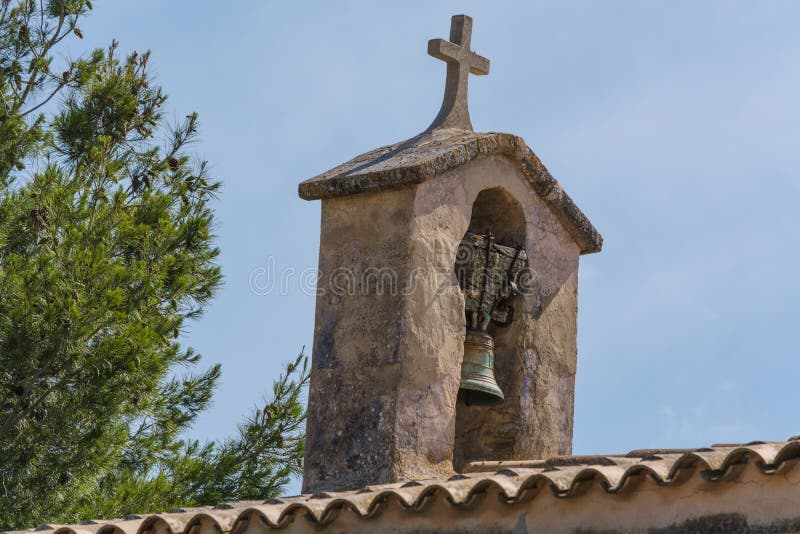 Church tower with bell in Spanish style stock photography Church tower with bell in Spanish style stock photography