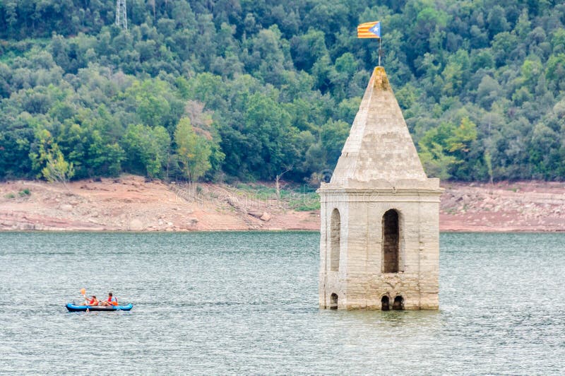 Church tower in Sau Reservoir, Catalonia, Spain. The tower of the church that is in the village under the water of Sau Reservoir in Catalonia, Spain royalty free stock images Church tower in Sau Reservoir, Catalonia, Spain. The tower of the church that is in the village under the water of Sau Reservoir in Catalonia, Spain royalty free stock images