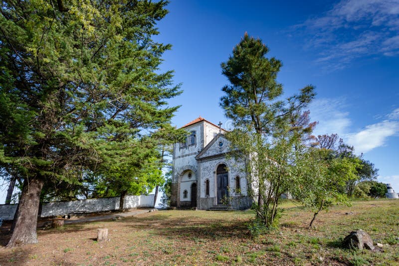 Church among  trees at summer time, in figueiro dos vinhos, portugal