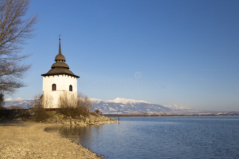 Church of Virgin Mary in Havranok and lake Liptovska Mara, district Liptovsky Mikulas, Slovakia