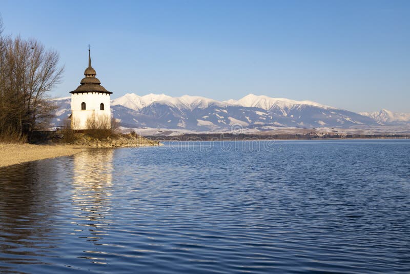 Church of Virgin Mary in Havranok and lake Liptovska Mara, district Liptovsky Mikulas, Slovakia