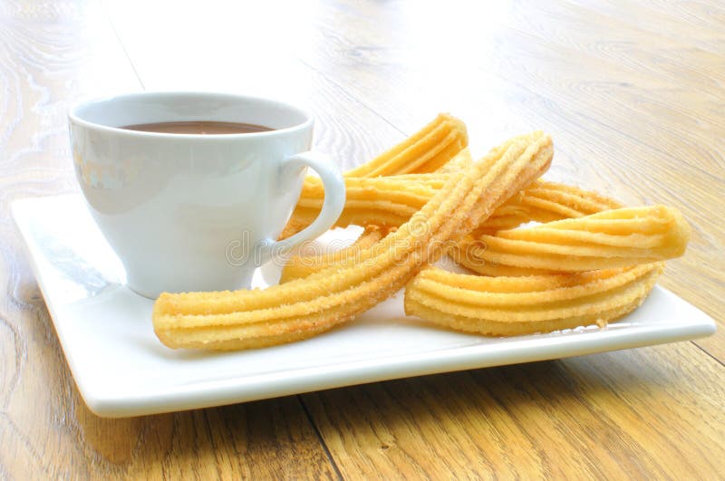 Churros with chocolate royalty free stock photo